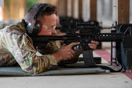 Staff Sgt. Tyler Culbertson, assigned to the 167th Aircraft Maintenance Squadron, fires an M4 carbine during weapons qualification training at the 167th Airlift Wing firing range in Martinsburg, W.Va., June 30, 2026. The training reinforced firearms safety, weapon familiarization and marksmanship skills to maintain combat readiness. (U.S. Air National Guard photo by Airman Colby Smith)