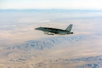 The YFQ-44A Collaborative Combat Aircraft flies over the Mojave Desert, Calif., July 10, 2026. The experimental aircraft fired an AIM-120 Advanced Medium-Range Air-to-Air Missile as part of a deliberate, phased test progression that began with inert carriage evaluations earlier this year. The autonomous aircraft is designed to operate alongside crewed platforms, extending their reach, survivability and effectiveness in contested environments. (U.S. Air Force photo)
