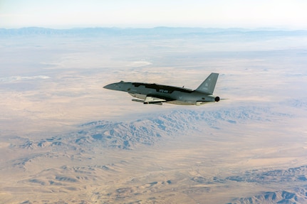 The YFQ-44A Collaborative Combat Aircraft flies over the Mojave Desert, Calif., July 10, 2026. The experimental aircraft fired an AIM-120 Advanced Medium-Range Air-to-Air Missile as part of a deliberate, phased test progression that began with inert carriage evaluations earlier this year. The autonomous aircraft is designed to operate alongside crewed platforms, extending their reach, survivability and effectiveness in contested environments. (U.S. Air Force photo)