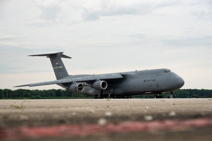 A C-5M Super Galaxy sits on the flightline at Dover Air Force Base, Del., June 18, 2026. The aircraft completed the installation’s C-5M flight deck refurbishment pilot project, restoring worn interior areas during a scheduled major isochronal inspection without adding maintenance downtime. (U.S. Air Force photo by Senior Airman Keira Rossman)