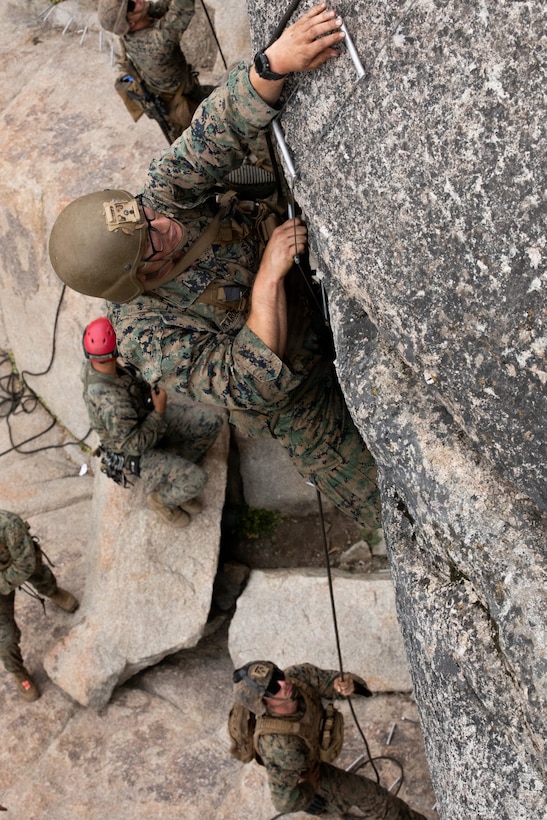 U.S. Marines with 3rd Battalion, 25th Marine Regiment, 4th Marine Division, execute an 8k cliff assault practical application during Mountain Training Exercise (MTX) 26-3, at Marine Corps Mountain Warfare Training Center, Bridgeport, California, July 12, 2026. MTX is an annual two-week training evolution that is designed to strengthen unit cohesion and prepare the battalion for rapid mobilization in support of future global operations. (U.S. Marine Corps photo by Cpl. Orion Stpierre)