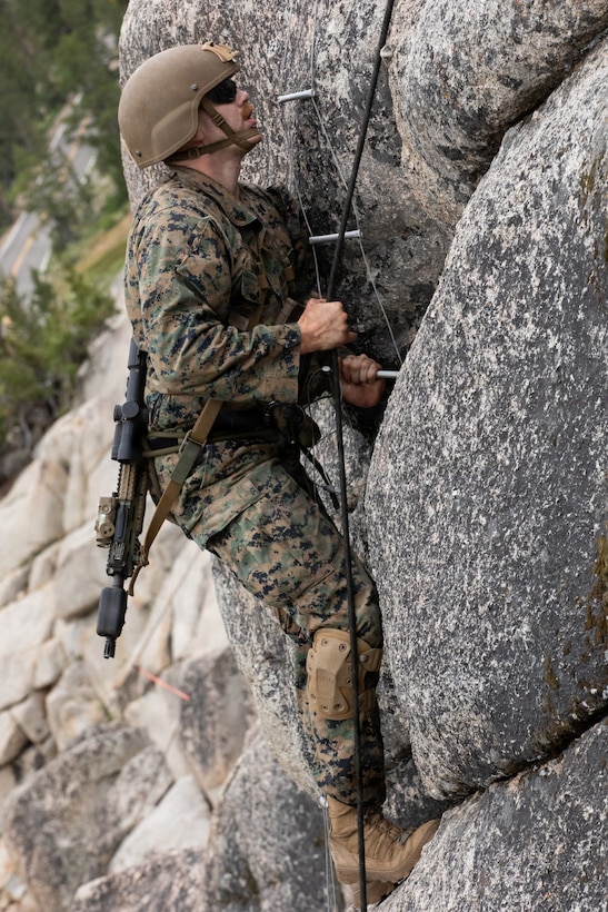 U.S. Marines with 3rd Battalion, 25th Marine Regiment, 4th Marine Division, execute an 8k cliff assault practical application during Mountain Training Exercise (MTX) 26-3, at Marine Corps Mountain Warfare Training Center, Bridgeport, California, July 12, 2026. MTX is an annual two-week training evolution that is designed to strengthen unit cohesion and prepare the battalion for rapid mobilization in support of future global operations. (U.S. Marine Corps photo by Cpl. Orion Stpierre)