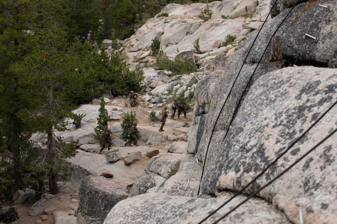 U.S. Marines with 3rd Battalion, 25th Marine Regiment, 4th Marine Division, execute an 8k cliff assault practical application during Mountain Training Exercise (MTX) 26-3, at Marine Corps Mountain Warfare Training Center, Bridgeport, California, July 12, 2026. MTX is an annual two-week training evolution that is designed to strengthen unit cohesion and prepare the battalion for rapid mobilization in support of future global operations. (U.S. Marine Corps photo by Cpl. Orion Stpierre)
