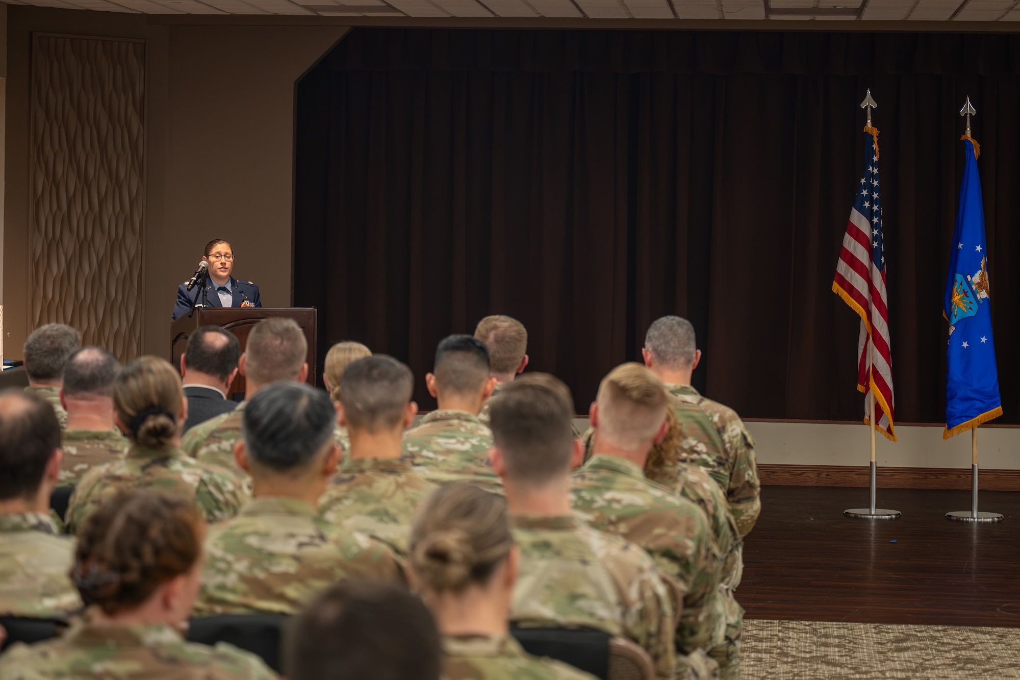 Lt. Col. Alicia Delia, incoming Geospatial Intelligence Analysis Squadron commander, addresses the unit for the first time during a change of command ceremony at Wright-Patterson Air Force Base, Ohio, July 1, 2026. Delia outlined her vision for the "Rampant Lions" as they continue to deliver tailored geospatial capabilities for the National Air and Space Intelligence Center. (U.S. Air Force photo by Staff Sgt. Kristof J. Rixmann)