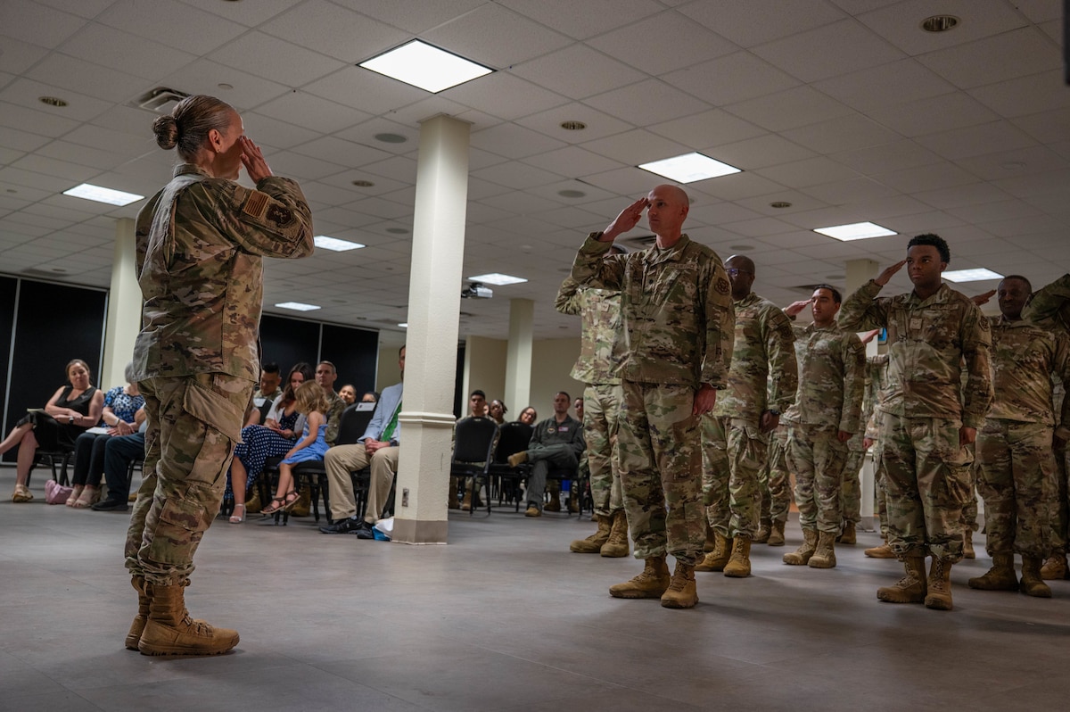 Col. Kelly Vermillion renders a final salute to Laughlin Medical Group Airmen.