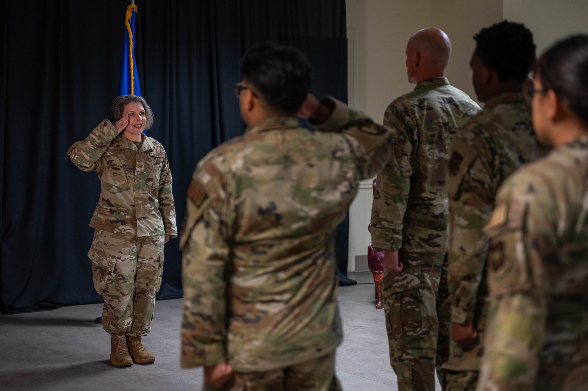 Col. Diane Caranta renders a first salute to Laughlin Medical Group Airmen.