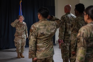Col. Diane Caranta renders a first salute to Laughlin Medical Group Airmen.
