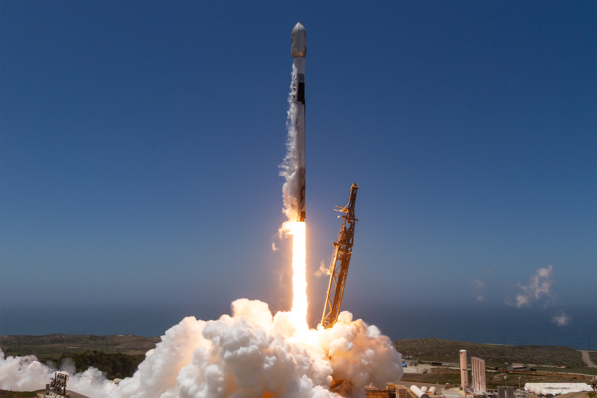 A SpaceX Falcon 9 rocket lifts off in support of a National Security Space Launch (NSSL) mission to deliver 21 Space Development Agency (SDA) data transport Trance 1 (T1) space vehicles to orbit from Space Launch Complex 4 East (SLC-4E), Vandenberg Space Force Base, Calif., on July 19, 2026. This launch was executed in partnership between the SDA and the Space Systems Command (SSC) System Delta 80 (SYD 80), which oversees the NSSL program team that performs independent mission assurance for the launch vehicle, leads the launch campaign, and together with the mission support provided by Space Launch Delta 30 (SLD 30), ensures the safe delivery of this SDA capability to low Earth orbit (LEO).  (Courtesy photo by SpaceX)