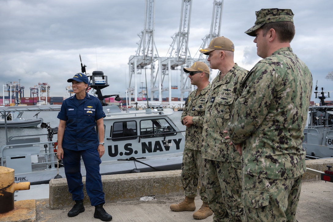 U.S. Coast Guard Vice Adm. Jo-Ann F. Burdian, Coast Guard Atlantic Area commander, speaks with U.S. Navy Sailors supporting Sail250 New York at the Coast Guard's Bayonne, New Jersey, staging area on July 5, 2026. Burdian recognized the teamwork and operational excellence displayed by Coast Guard and Navy units supporting Sail250 New York, with special appreciation for crews who weathered the July 3 storm. (U.S. Coast Guard photo by Petty Officer 2nd Class Gabriel Wisdom)