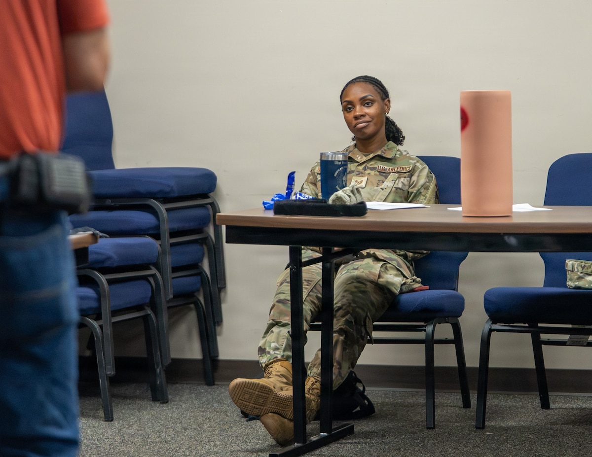 U.S. Air Force Tech. Sgt. Staci Starks-Miller, a Warrant Officer Training School Air Force Train, Advise, Coach Officer (AFTAC) course student, listens to a briefing on combat casualty care (CCC), including cardiopulmonary resuscitation and automated external defibrillator (AED) operation, during instructor qualification training at Maxwell Air Force Base, Alabama, July 14, 2026.