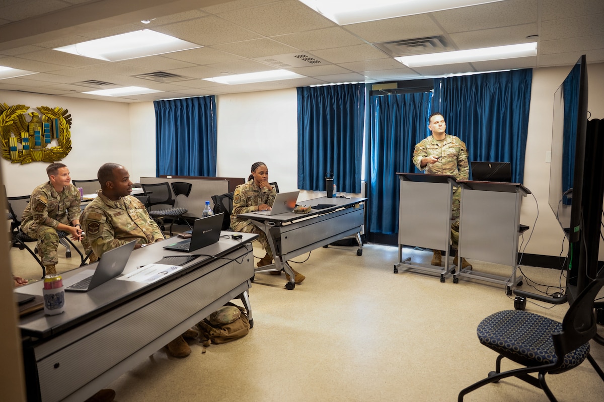 U.S. Air Force Chief Warrant Officer 2 Jonathan Miller, 26th Network Operations Squadron chief technical advisor, briefs students on leadership styles during the Air Force Train, Advise, Coach Officer (AFTAC) course at Maxwell Air Force Base, Alabama, July 14, 2026.