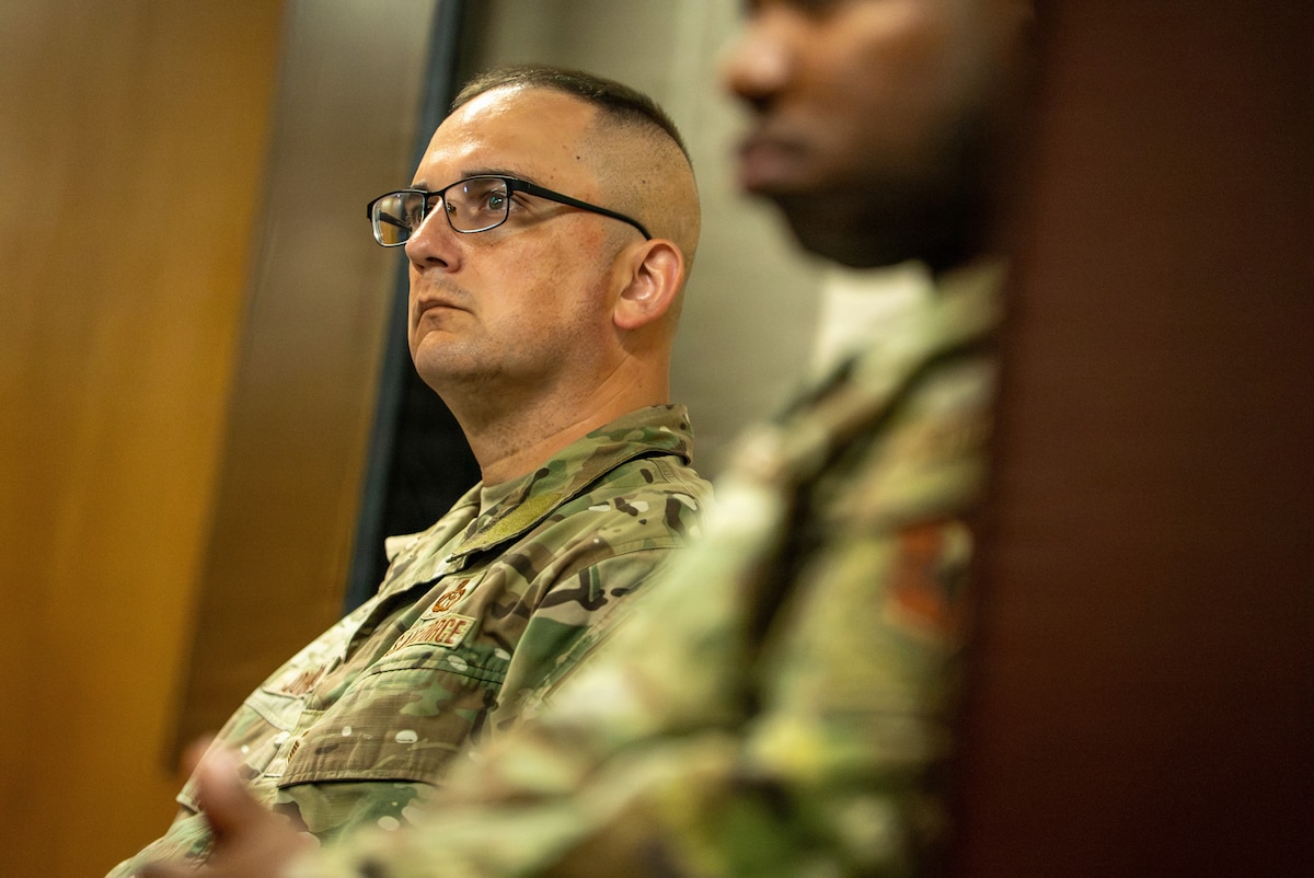 U.S. Air Force Senior Master Sgt. Kevin Johnson, a Warrant Officer Training School Air Force Train, Advise, Coach Officer (AFTAC) course student, listens to a briefing on combat casualty care (CCC), including cardiopulmonary resuscitation and automated external defibrillator operation, during instructor qualification training at Maxwell Air Force Base, Alabama, July 14, 2026.