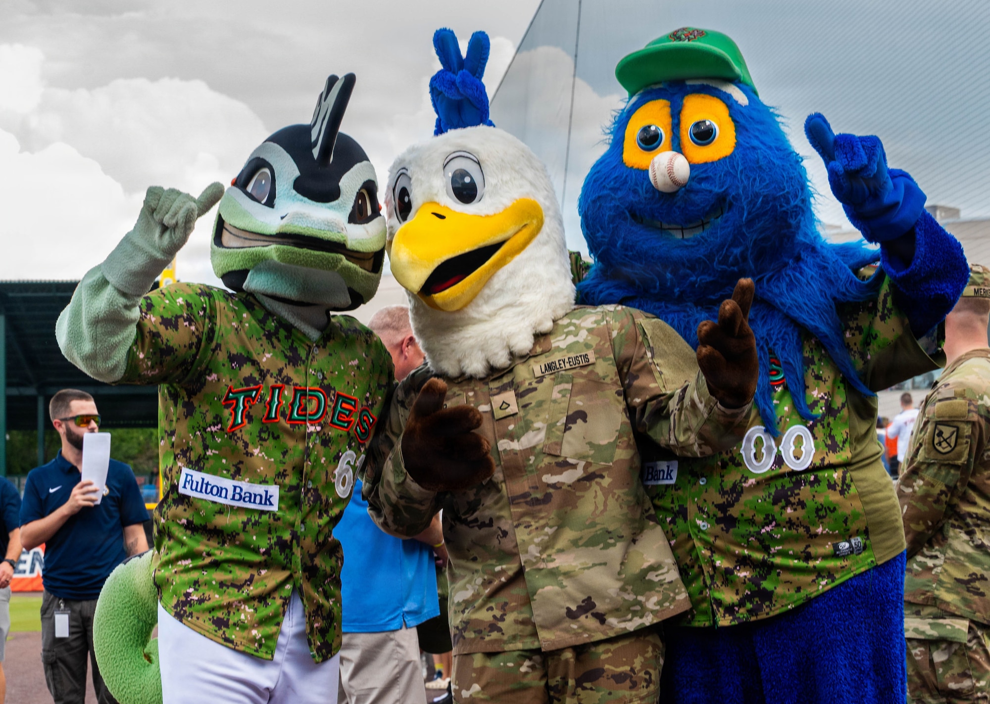 Mascots stand together.