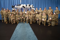 Technical Sergeant selectees pose for a group photo with deputy commander and command chief.