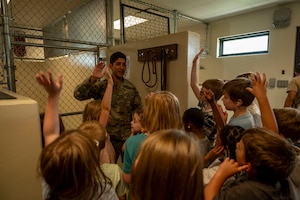School age care kids tour 319th Security Forces Squadron