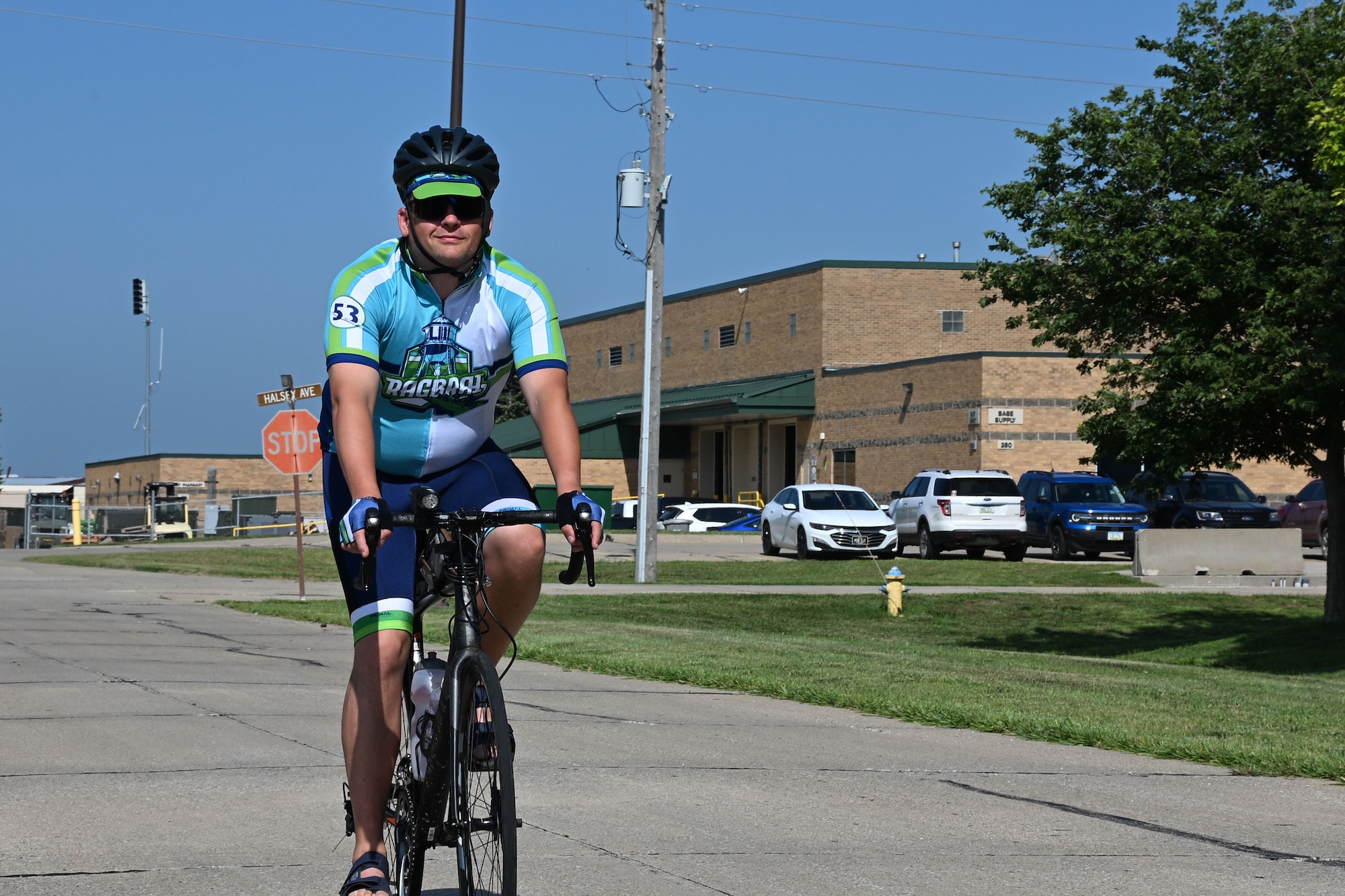 U.S. Air Force Master Sgt. Shane Meendering, 185th Air Refueling Wing Cyber Systems Operations noncommissioned officer in charge, rides his bicycle on a road at the 185th Air Refueling Wing.