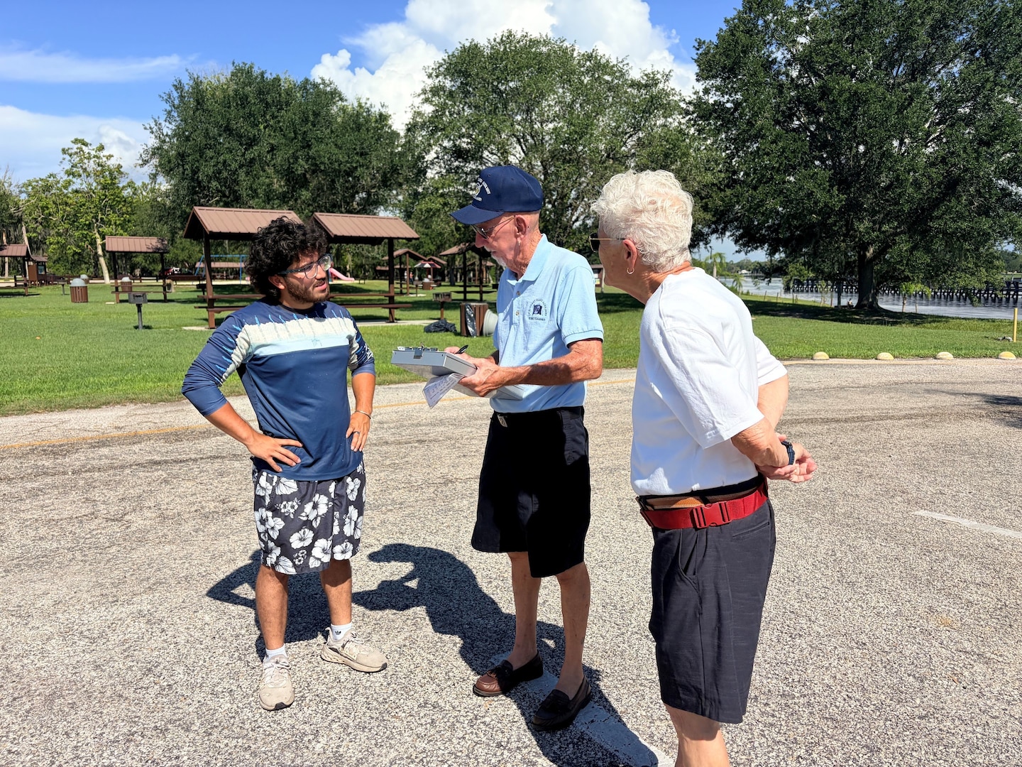Jim and Sue, volunteers with the U.S. Coast Guard Auxiliary, conduct a voluntary vessel safety examination with a boater during a Fourth of July water safety outreach event at the W.P. Franklin South boat ramp in Alva, Florida, July 4, 2026. The outreach was conducted in partnership with the U.S. Army Corps of Engineers Jacksonville District to promote safe boating practices during the busy holiday weekend. (U.S. Army photo by Park Ranger Megan Parsons)