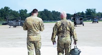 Chief Warrant Officer 5 Herb Stevens, right, State Standardization Pilot and Commander of Army Aviation Support Facility 1 in Kankakee, is joined by Chief Warrant Officer 3 Daniel Wentworth, Illinois Army National Guard Instructor Pilot, on Stevens’ final flight July 16 as an Army Aviator in the Illinois Army National Guard.