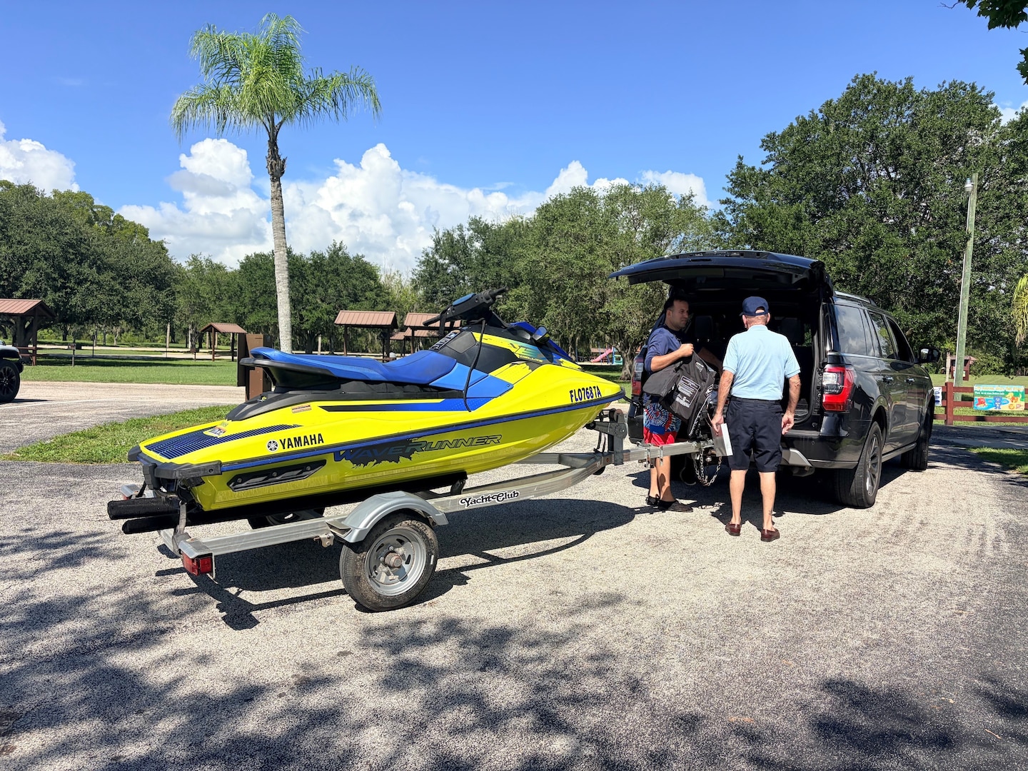 Jim, a volunteer with the U.S. Coast Guard Auxiliary, conducts a voluntary vessel safety examination with a personal watercraft operator during a Fourth of July water safety outreach event at the W.P. Franklin South boat ramp in Alva, Florida, July 4, 2026. The event provided visitors with free safety inspections and boating education before they launched. (U.S. Army photo by Park Ranger Megan Parsons)