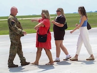 Chief Warrant Officer 5 Herb Stevens, State Standardization Pilot and Commander of Army Aviation Support Facility 1 in Kankakee, is greeted by his family, including wife, Lynette, and daughters Hanna Stevens and Maggie Dhami, following Stevens’ final flight as an Army Aviator July 16 in the Illinois Army National Guard.