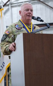 Chief Warrant Officer 5 Herb Stevens, State Standardization Pilot and Commander of the Army Aviation Support Facility (AASF) 1 in Kankakee, thanks family, friends, and fellow Soldiers for their support during a retirement ceremony July 16 at AASF 2 in Decatur.