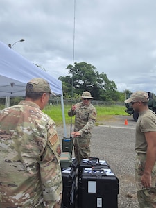 U.S. Air Force Tech. Sgt. Omar Berdecia, a radio frequency transmission systems specialist, sets-up an AN/PRC-160 radio during exercise FUNKY BUSINESS at the 130th Engineer Battalion, Vega Baja, Puerto Rico, June 4, 2026. The exercise tested Airmen's ability to rapidly establish expeditionary communications and sustain mission readiness through realistic deployment operations and disciplined logistical procedures. (U.S. Air National Guard courtesy photo)