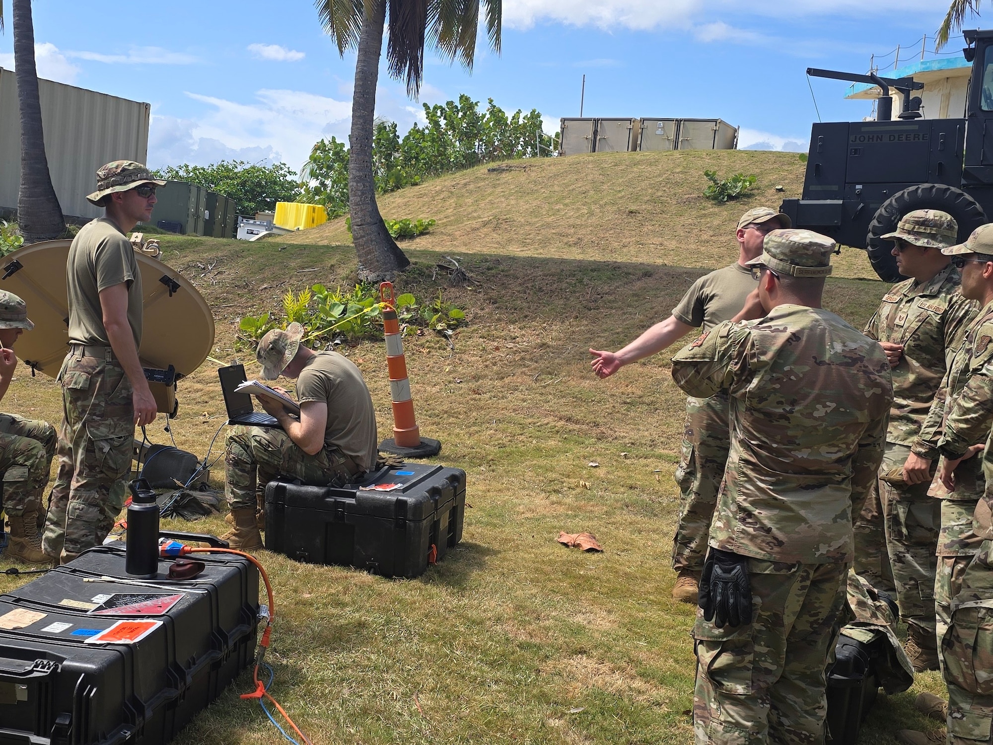 U.S. Airmen with the 282nd Combat Communications Squadron, Rhode Island Air National Guard, discusses the capabilities of the Airbus Ranger 1.2M terminal with Airmen assigned to the 156th Combat Communications Squadron, Puerto Rico Air National Guard during exercise FUNKY BUSINESS at Punta Salinas Air National Guard Station, Toa Baja, Puerto Rico, June 10, 2026. The exercise tested Airmen's ability to rapidly establish expeditionary communications and sustain mission readiness through realistic deployment operations and disciplined logistical procedures. (U.S. Air National Guard courtesy photo)