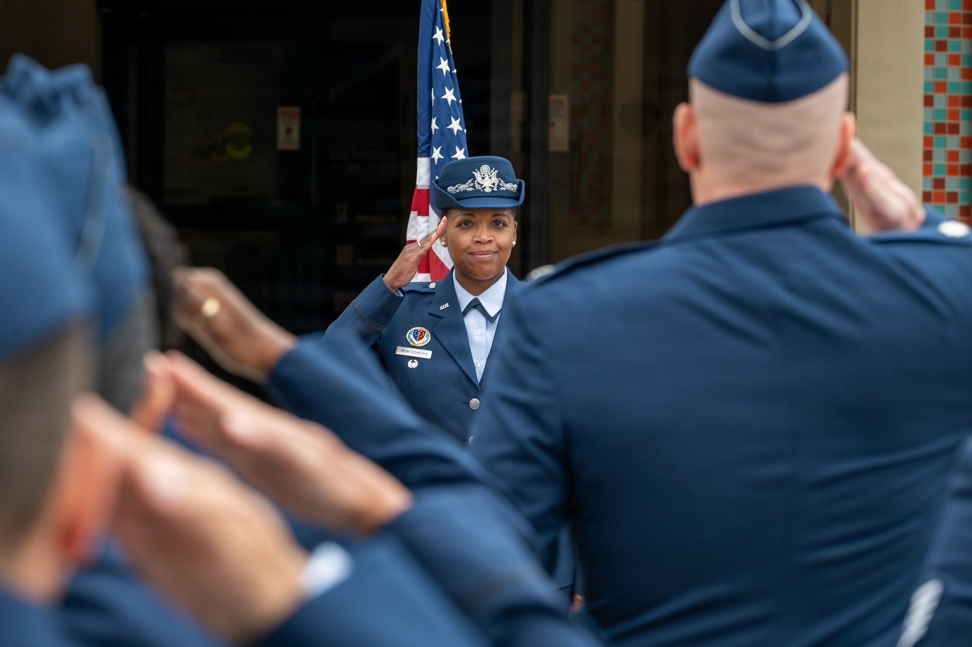 A person stands and salutes