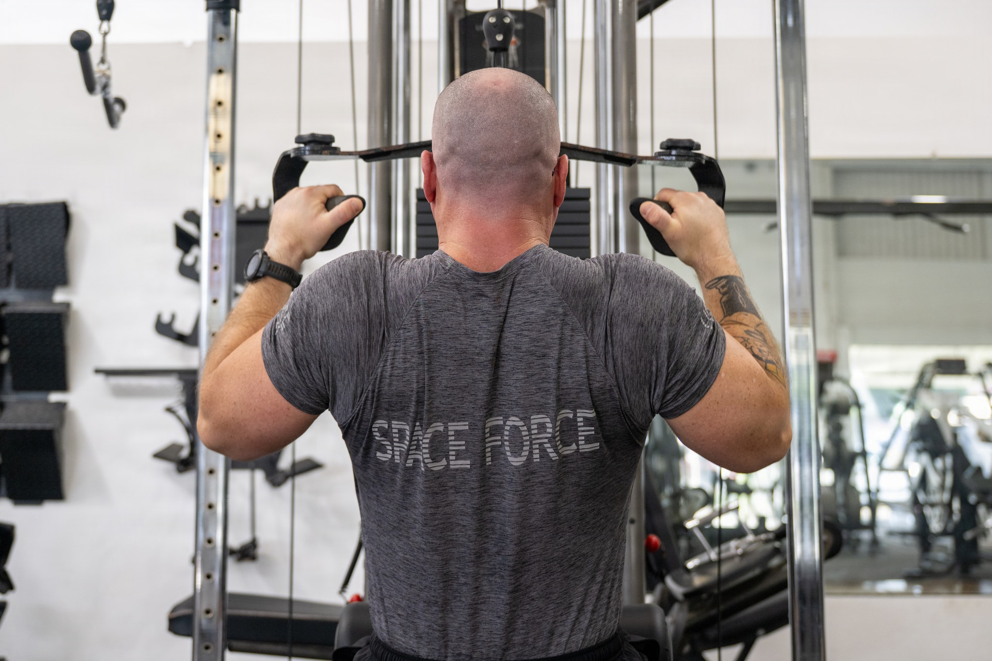 U.S. Space Force 1st Lt. Thomas Moriarty, 53rd Space Operations Squadron Detachment 4 operations officer, works out in a gym in Honolulu.