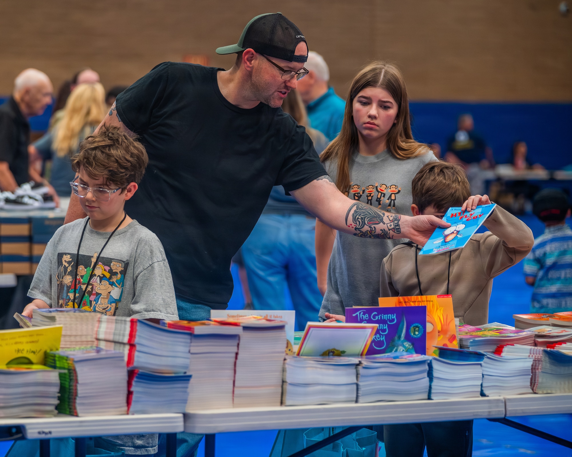 A military family collects school supplies during the Back to School Bash held at Luke Air Force Base, Arizona, July 14, 2026.