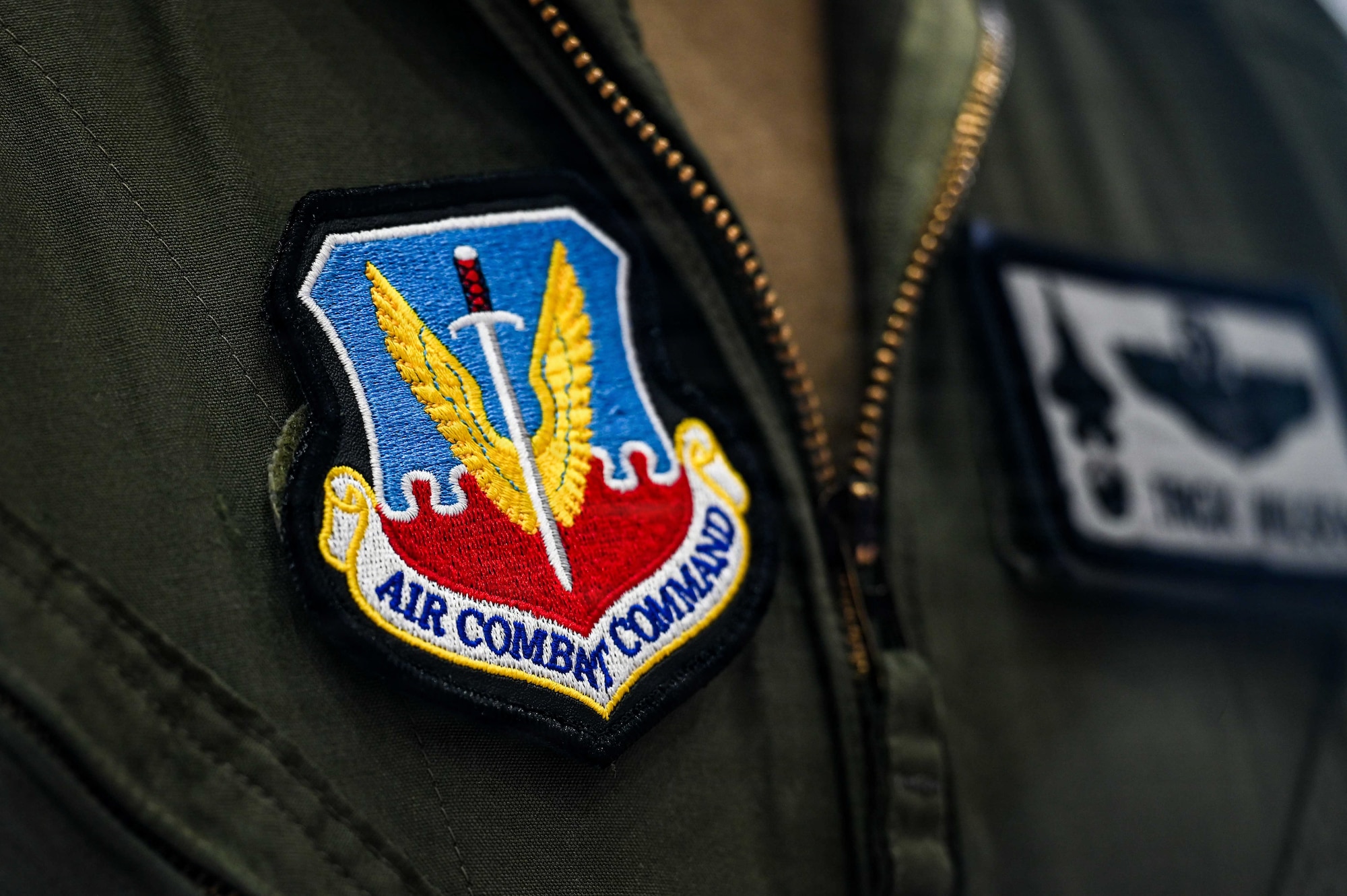 An Air Combat Command patch is worn during a change of command ceremony.