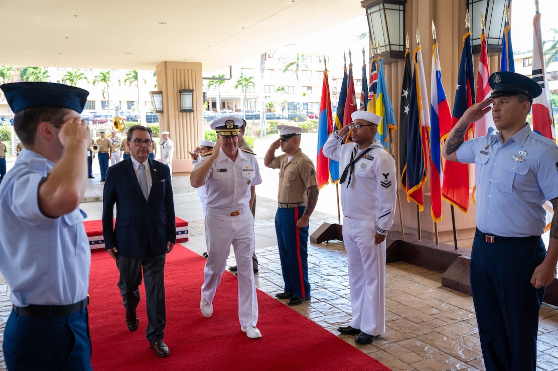 Adm. Samuel J. Paparo, right, commander of U.S. Pacific Command, salutes during an honors ceremony welcoming His Excellency Fernando Barros, left, Minister of National Defense of Chile, to the US PACOM headquarters building at Camp H.M. Smith, Hawaii, July 17, 2026.