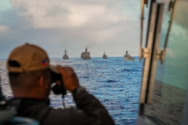 A Sailor assigned to the Philippine Navy Miguel Malvar-class guided-missile frigate BRP Miguel Malvar (FFG06) overlooks as the USNS Guadalupe comes alongside for a replenishment-at-sea in the Pacific Ocean during Exercise Rim of the Pacific 2026, July 11, 2026.