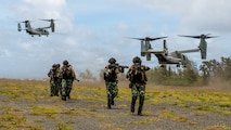 Indonesian marines disembark a U.S. Marine Corps MV-22B Osprey attached to Marine Medium Tiltrotor Squadron (VMM) 164 (Reinforced), 15th Marine Expeditionary Unit, during an amphibious raid training event as part of Exercise Rim of the Pacific 2026 at Marine Corps Training Area Bellows, Hawaii, July 12, 2026.