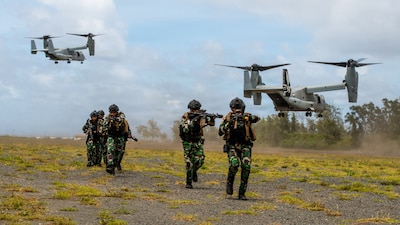 Indonesian marines disembark a U.S. Marine Corps MV-22B Osprey attached to Marine Medium Tiltrotor Squadron (VMM) 164 (Reinforced), 15th Marine Expeditionary Unit, during an amphibious raid training event as part of Exercise Rim of the Pacific 2026 at Marine Corps Training Area Bellows, Hawaii, July 12, 2026.