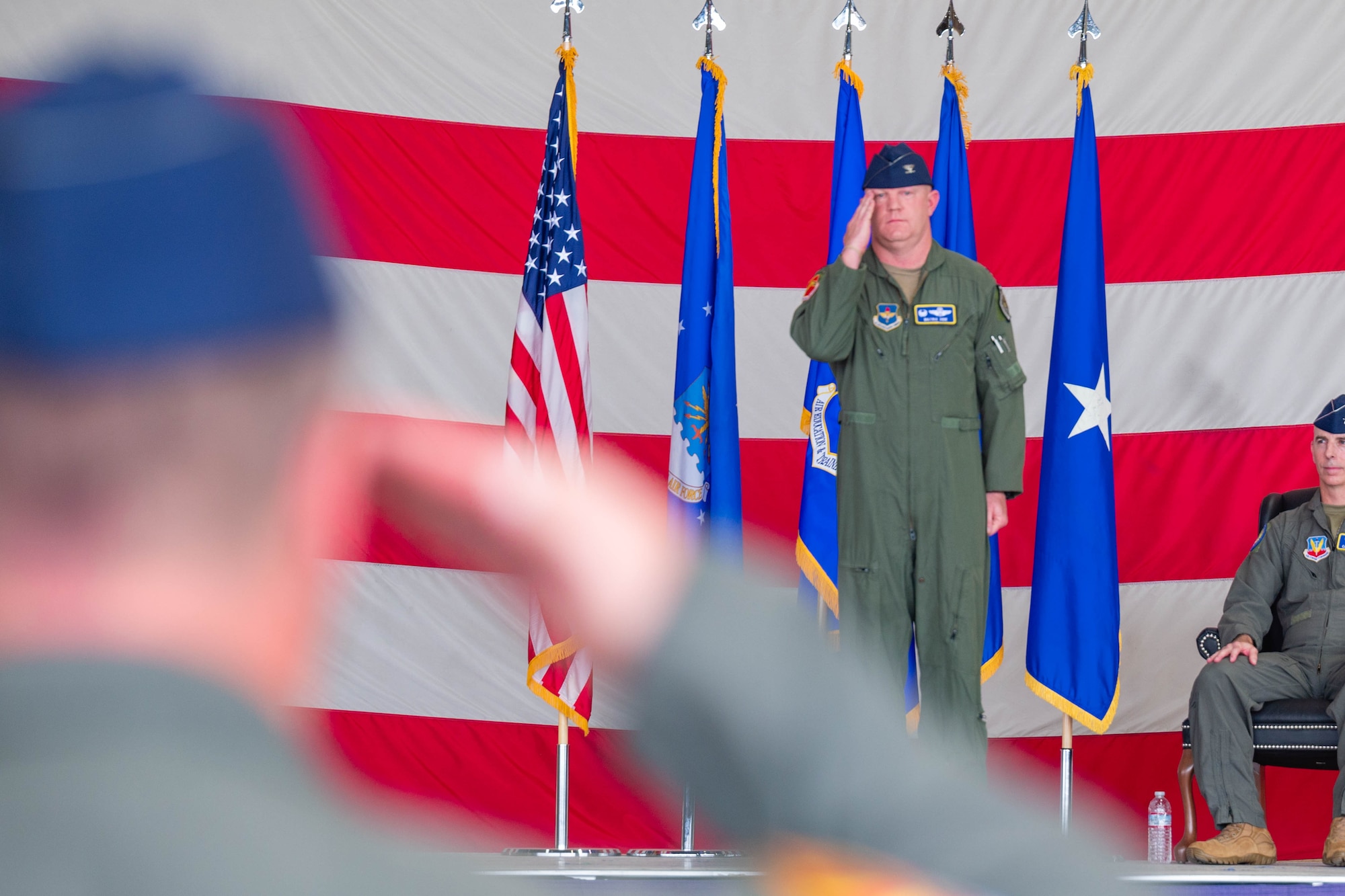 A U.S. Airman renders his first salute while assuming command of a Fighter Wing.