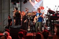 Members of the Lt. Dan Band perform during a concert at Holloman Air Force Base, New Mexico, July 12, 2026. Since 2003, Gary Sinise and the Lt. Dan Band have performed over 600 shows at military installations for service members, first responders, veterans and their families to raise money through the Gary Sinise Foundation in support of disabled veterans. (U.S. Air Force photo by Senior Airman Michelle Ferrari)