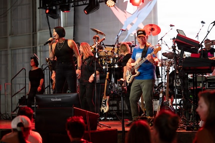 Members of the Lt. Dan Band perform during a concert at Holloman Air Force Base, New Mexico, July 12, 2026. Since 2003, Gary Sinise and the Lt. Dan Band have performed over 600 shows at military installations for service members, first responders, veterans and their families to raise money through the Gary Sinise Foundation in support of disabled veterans. (U.S. Air Force photo by Senior Airman Michelle Ferrari)