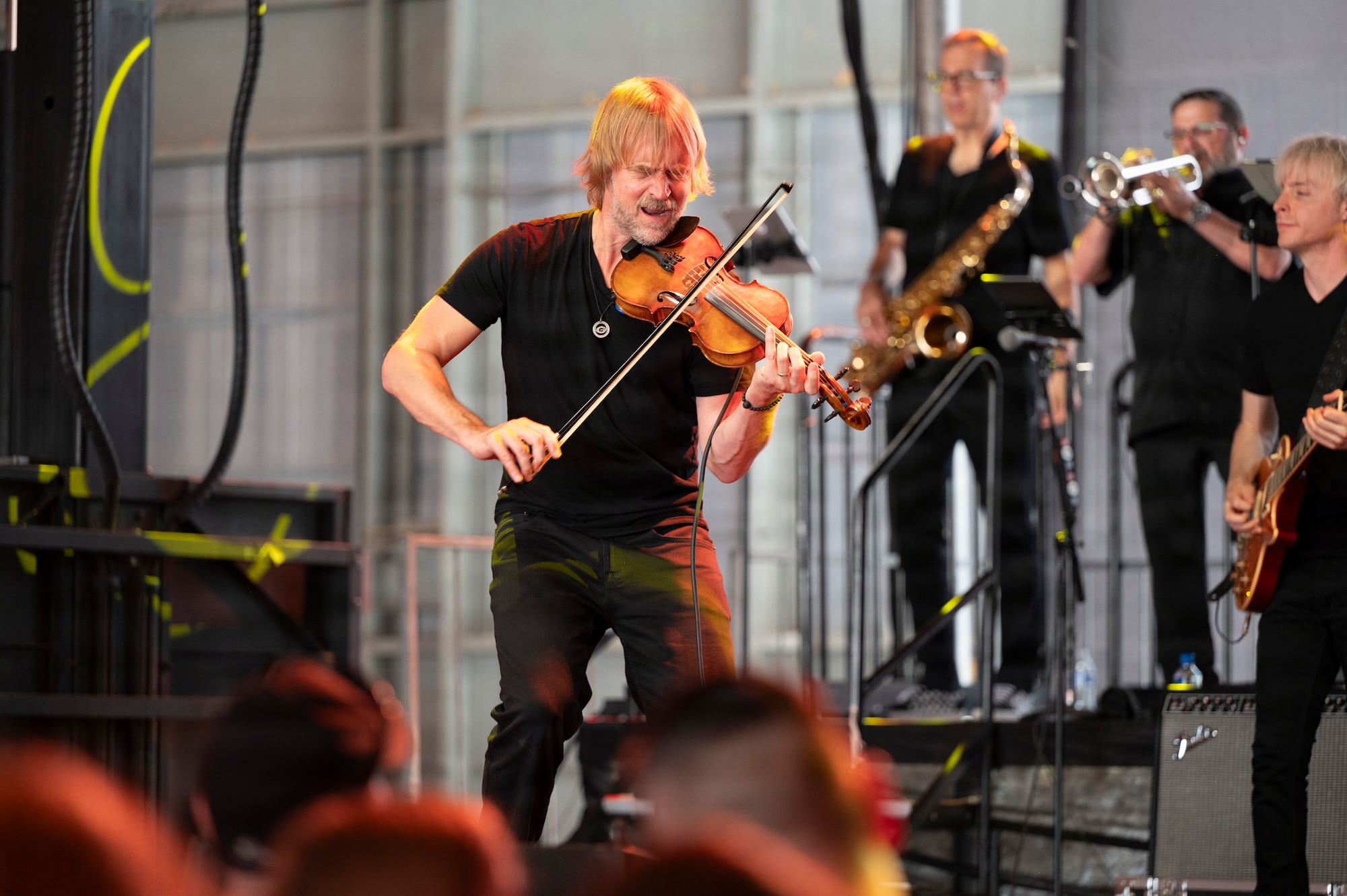 Dan Myers, violin player and vocalist of the Lt. Dan Band, performs at Holloman Air Force Base, New Mexico, July 12, 2026. The concert provided an evening of live entertainment promoting morale and honoring service members and their families. (U.S. Air Force photo by Senior Airman Michelle Ferrari)