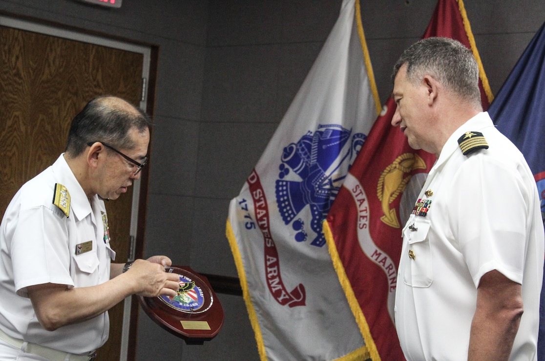 NAVAL BASE GUAM (June 18, 2026) - U.S. Naval Base Guam (NBG) Commanding Officer Capt. Shawn William met with Japan Maritime Self Defense Fleet (JMSDF) Rear Adm. Kimihiro Ichiyanagi, commander of JMSDF Surface Warfare Group Two at the NBG Headquarters, June 17. 
During the visit, both Ichiyanagi and William thanked each other for their support and exchanged tokens of appreciation. 
JMSDF Surface Warfare Group Two arrived at Apra Harbor as part of a scheduled port visit.