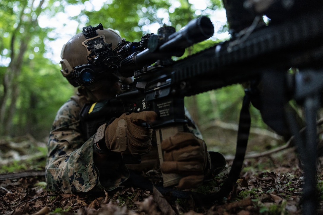 U.S. Marine Corps Cpl. Jeovanny Martinez, a rifleman with 12th Littoral Combat Team, 12th Marine Littoral Regiment, 3rd Marine Division, sights in with an M27 infantry automatic rifle during a force-on-force raid at Combined Arms Training Center Camp Fuji, Japan, July 16, 2026.