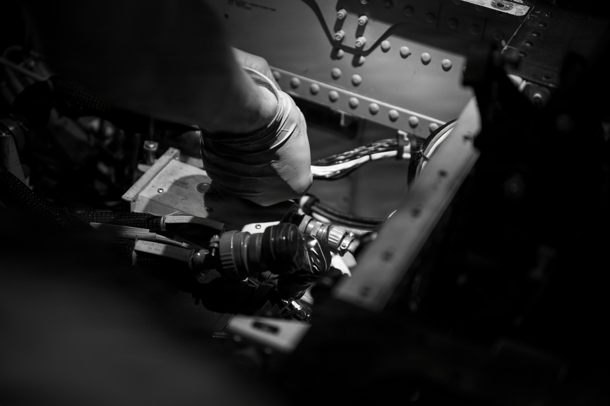 A man looks at the interior of a helicopter.