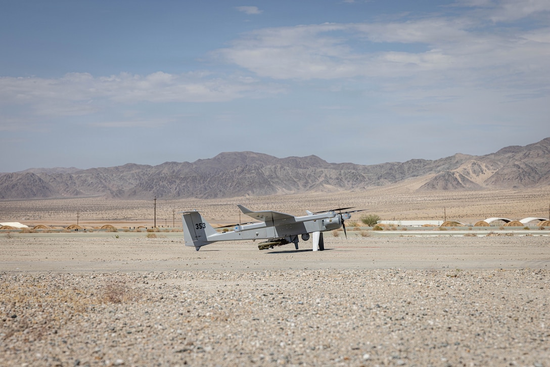 A JUMP 20-X is displayed prior to takeoff during a flight launch at Service Level Training Exercise 4-26 on Marine Corps Air Ground Combat Center, Twentynine Palms, California, July 16, 2026. JUMP 20-X is a Group 3 vertical takeoff and landing unmanned aircraft system designed for multi-domain operations across land and sea, combining the hovering capabilities of a multirotor with the range and efficiency of a fixed-wing plane. SLTE 4-26 is designed to be a challenging, realistic training environment that produces combat-ready forces capable of operating as an integrated Marine Air Ground Task Force across all domains of military operations. (U.S. Marine Corps photo by Sgt. Alexis French)