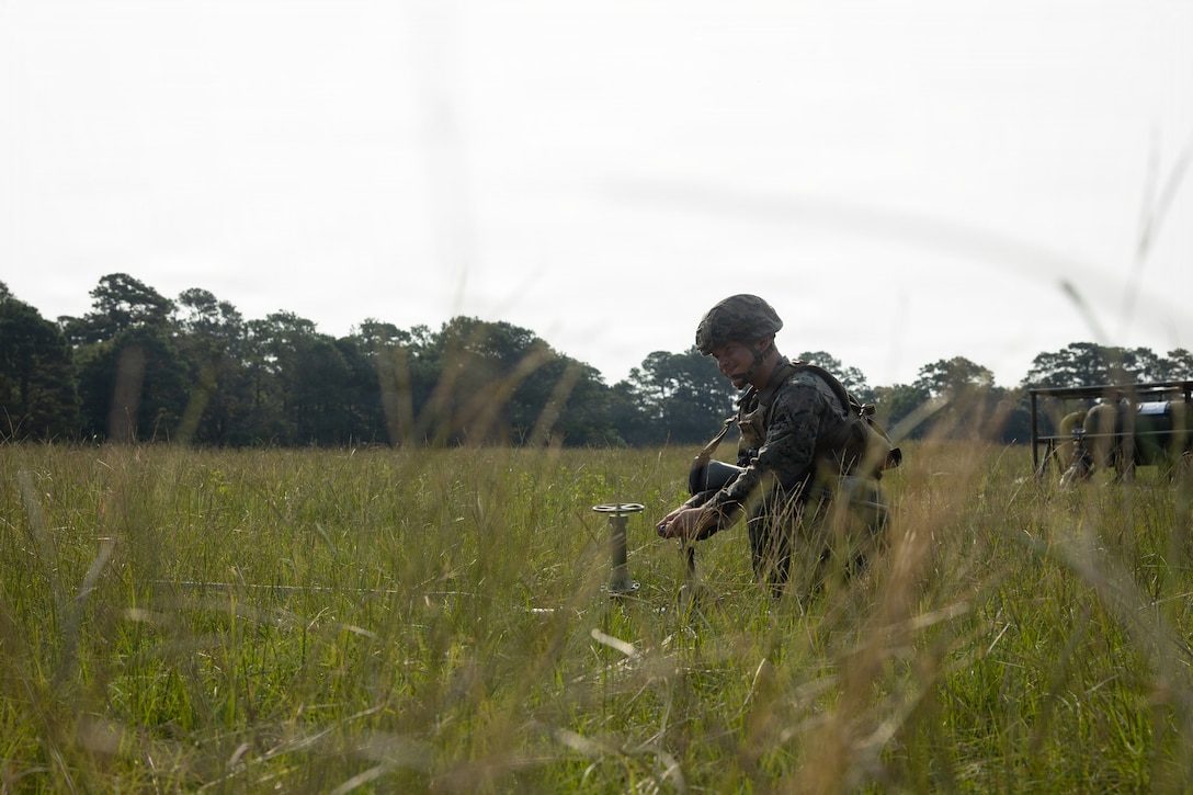 U.S. Marine Corps Cpl. Devin Carpenter, an expeditionary fuels technician with 8th Engineer Support Battalion, Combat Logistics Regiment 27, 2nd Marine Logistics Group, turns a valve on a fuel line at Marine Corps Base Camp Lejeune, North Carolina, July 17, 2026. 8th ESB constructed and established an Amphibious Assault Fuel System and cantonment site to support the II Marine Expeditionary Force. Carpenter is a native of Ohio. (U.S. Marine Corps photo by Lance Cpl. Isabelle Veillette)