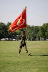 U.S. Marine Corps Sgt. Maj. Leo Cuellar Jr., the sergeant major of The Basic School, delivers the TBS colors during a change of command ceremony at Marine Corps Base Quantico, Virginia, July 15, 2026. During the ceremony, Col. Robert G. McCarthy III relinquished command of TBS to Col. Charles E. Miller II. (U.S. Marine Corps photo by Cpl. Joshua Barker)