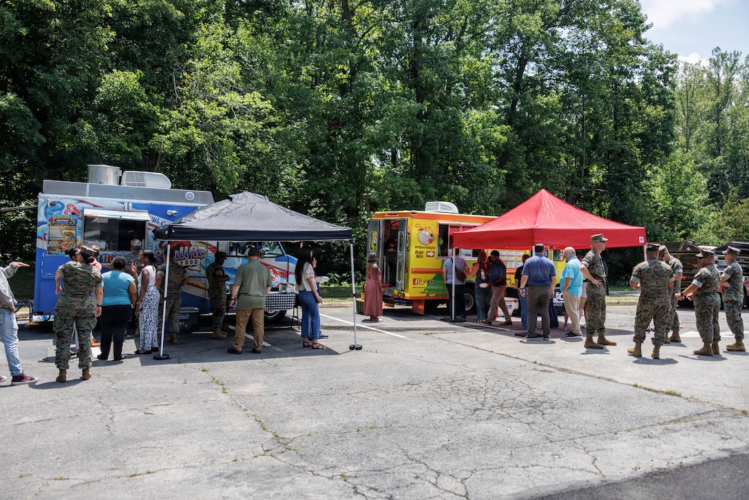 U.S. Marines and community members stand in line during the grand opening of “Bites on Site” on Marine Corps Base Quantico, Virginia, July 9, 2026. The grand opening featured local food vendors, activities, and a raffle with the food trucks operating at 3380 Russell Road Wednesdays through Fridays from 1100 to 1400. (U.S. Marine Corps photo by Sgt. Dean Gurule)