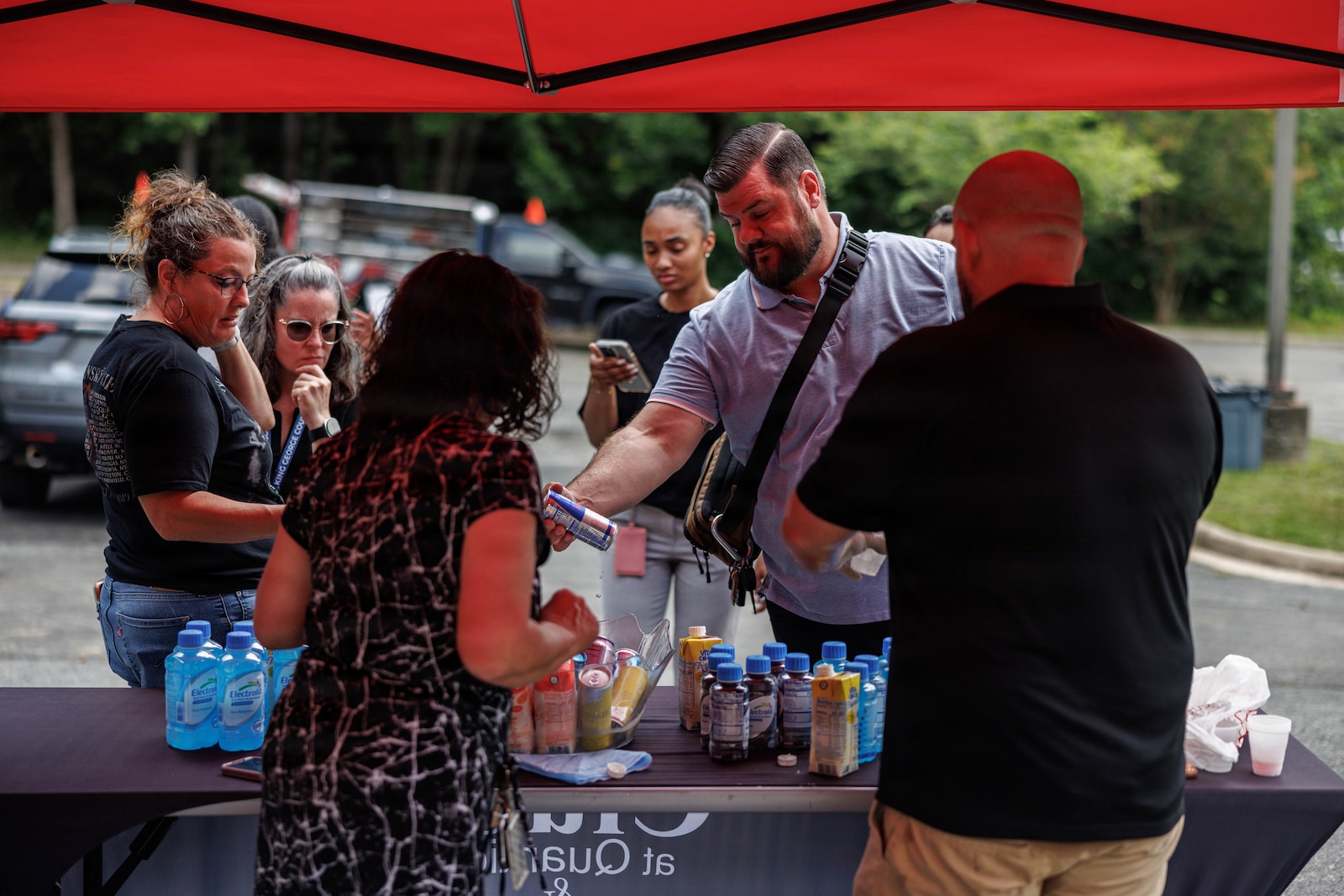 Community members try free drink samples during the grand opening of “Bites on Site” on Marine Corps Base Quantico, Virginia, July 9, 2026. The grand opening featured local food vendors, activities, and a raffle with the food trucks operating at 3380 Russell Road Wednesdays through Fridays from 1100 to 1400. (U.S. Marine Corps photo by Sgt. Dean Gurule)