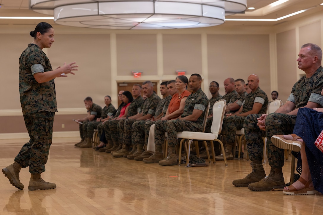 U.S. Marine Corps Sgt. Maj. Elena M. Rodriguez, the outgoing command senior enlisted leader of 2nd Marine Expeditionary Brigade, speaks to Marines, Sailors and family members during the 2nd MEB relief and appointment ceremony at Marine Corps Base Camp Lejeune, North Carolina, June 17, 2026. The relief and appointment ceremony represents the transfer of responsibility and accountability from the outgoing to the incoming sergeant major. (U.S. Marine Corps photo by Lance Cpl. Sabine Wilson)