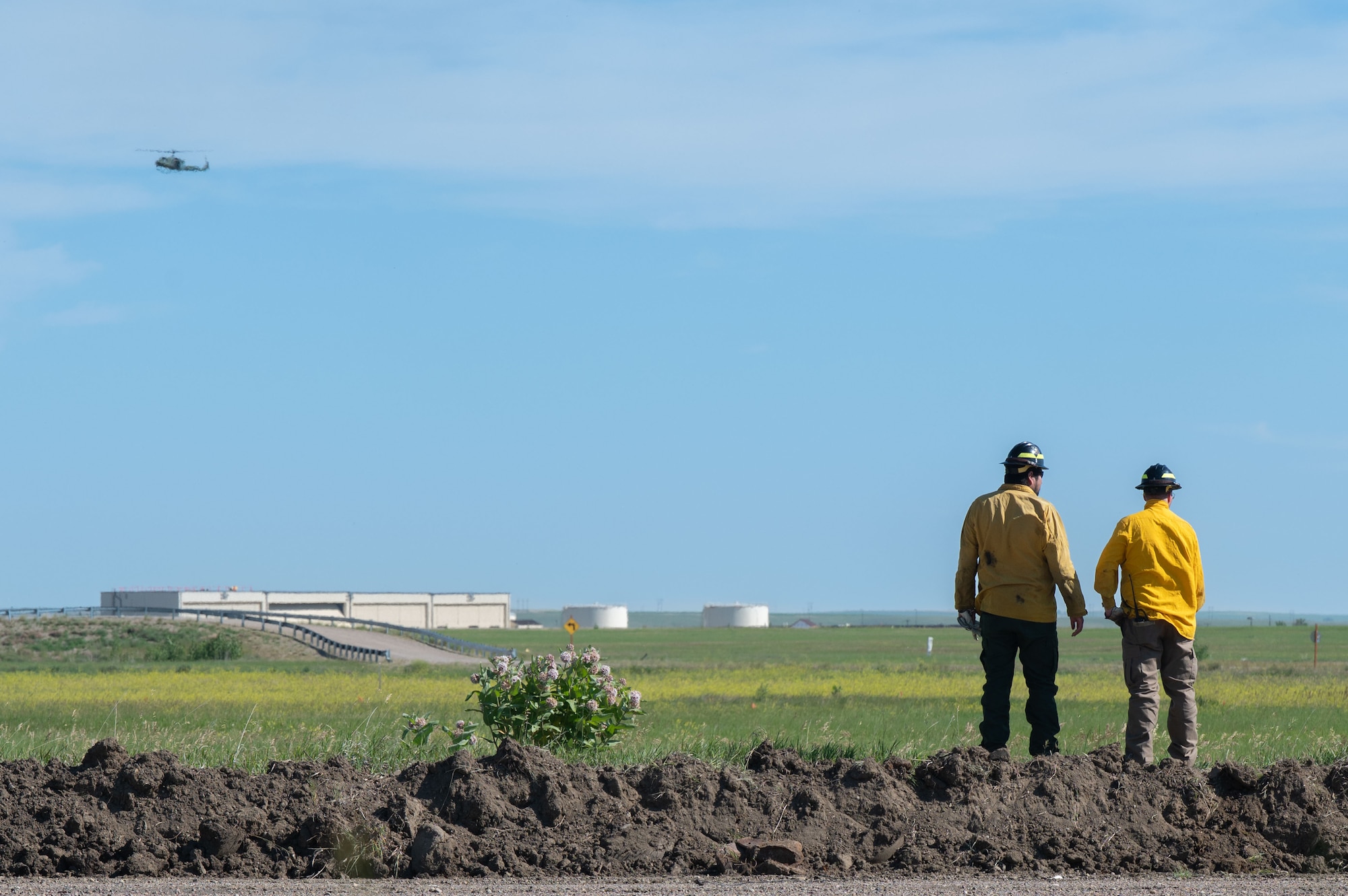 Air Force Civil Engineer Center Wildland Support Module personnel scout the area around a prescribed burn at Malmstrom Air Force Base, July 8, 2026.