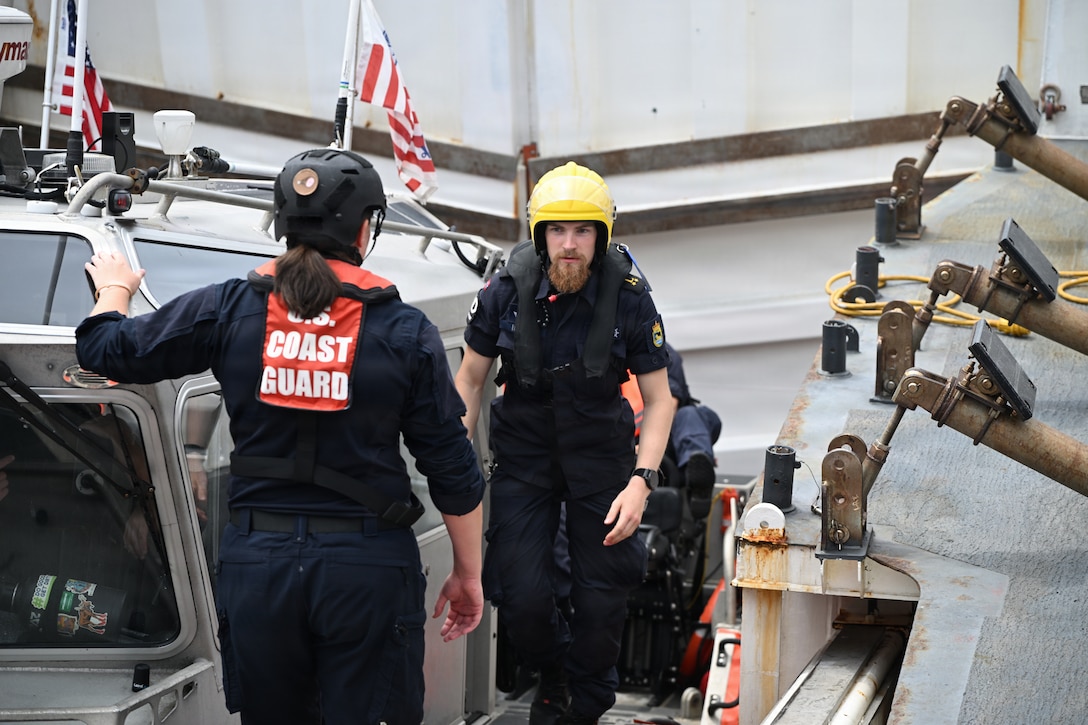 U.S. Coast Guard crew members aboard the Legend-class national security cutter USCGC Stone (WMSL 758) welcome members of the Norwegian coast guard aboard during joint training, July 10, 2026. The visit is part of ongoing efforts to build interoperability between the two nations' crews. (U.S. Coast Guard photo by Petty Officer 2nd Class Laticia Sims)